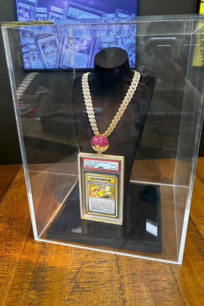 Pikachu Illustrator card behind glass protective case