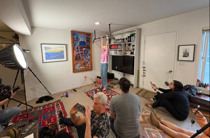 Ann completing the hang in front of her family