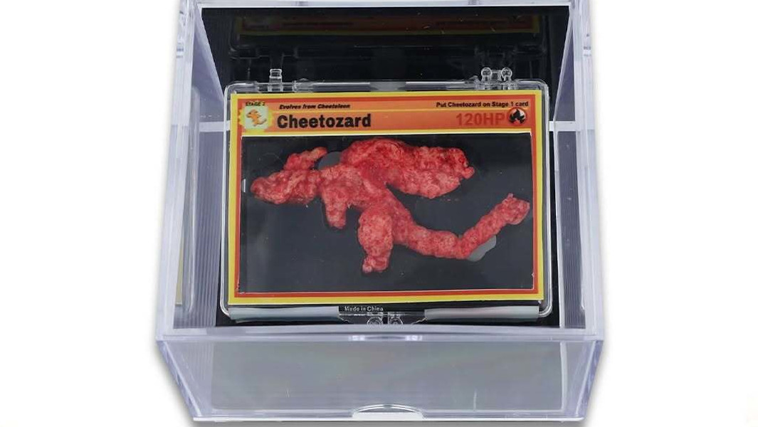 Split header image of Ken Goldin holding GWR certificate and the Charizard Cheeto