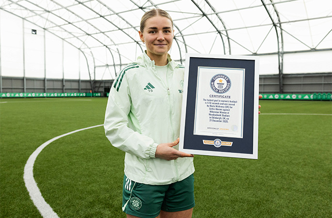 Maria holding her GWR certificate