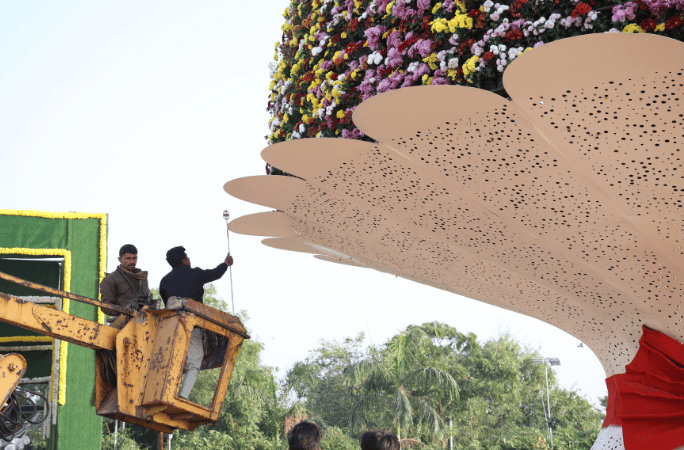 Construction worker in a crane approaches the bouquet