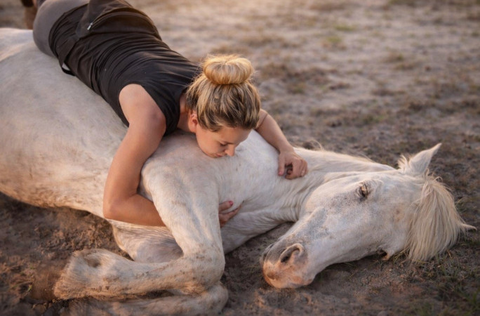 Lauryn laying on top of Gringo