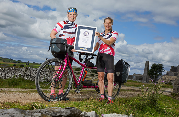 two women with a tandem bike