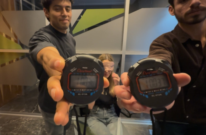 Luisa's timekeepers holding their stopwatches