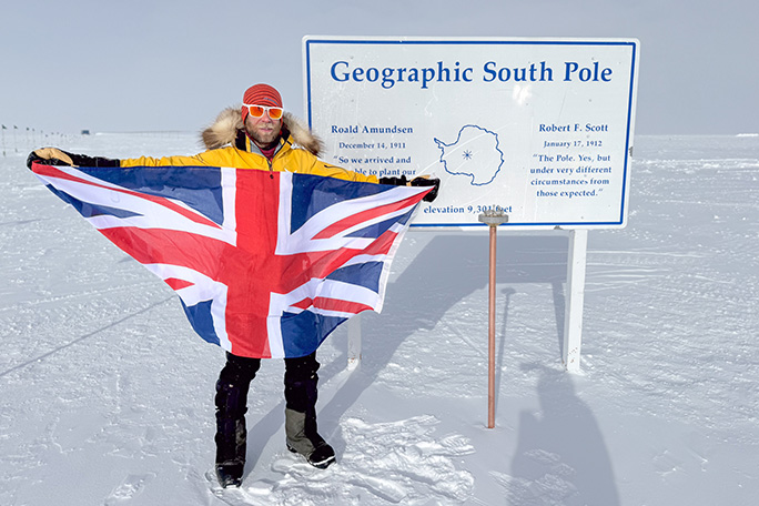 jonny-huntington-at-south-pole-holding-union-jack-flag