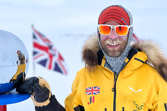 jonny-huntington-at-south-pole-marker-post