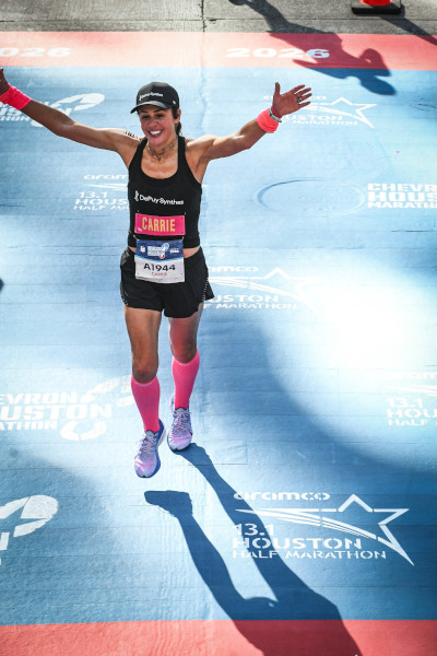 Carrie crossing the finish line