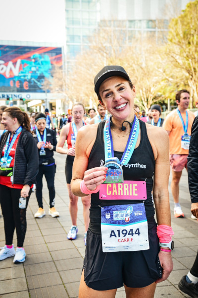 Carrie holding her medal