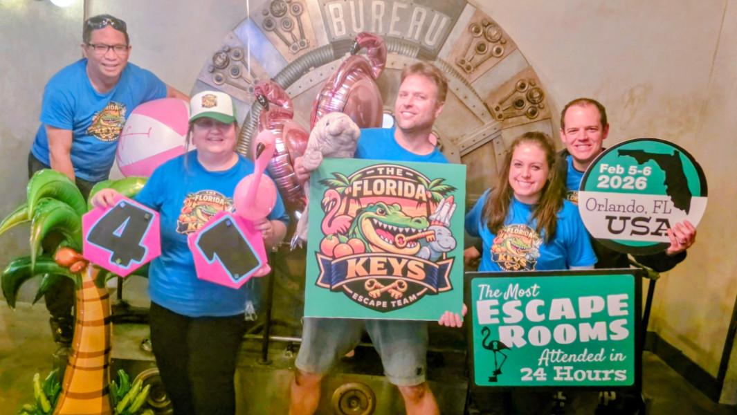 The Florida Keys holding celebratory GWR signs outside an escape room