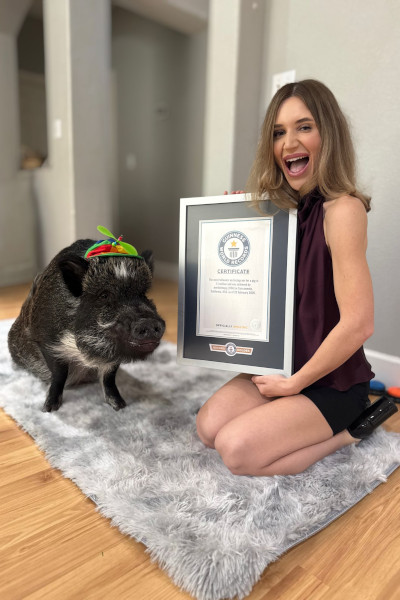 Mona and Merlin looking excited with their certificate