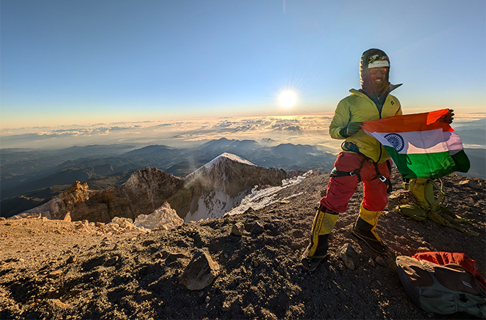 Anmish holding a flag