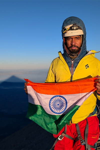 Anmish holding a flag