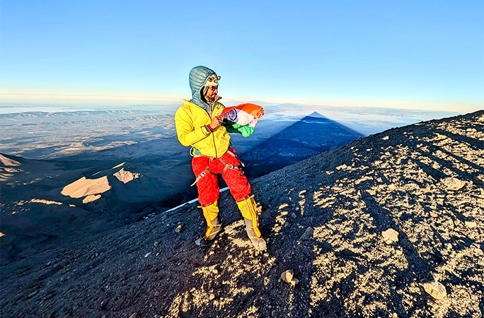 Anmish holding a flag