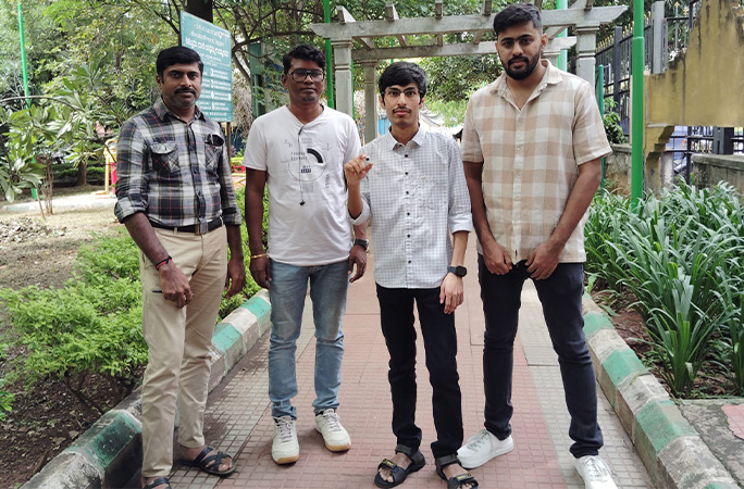 Kiran holding the arcade machine