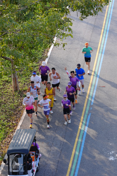 Long Shao running in a group, drone shot from above