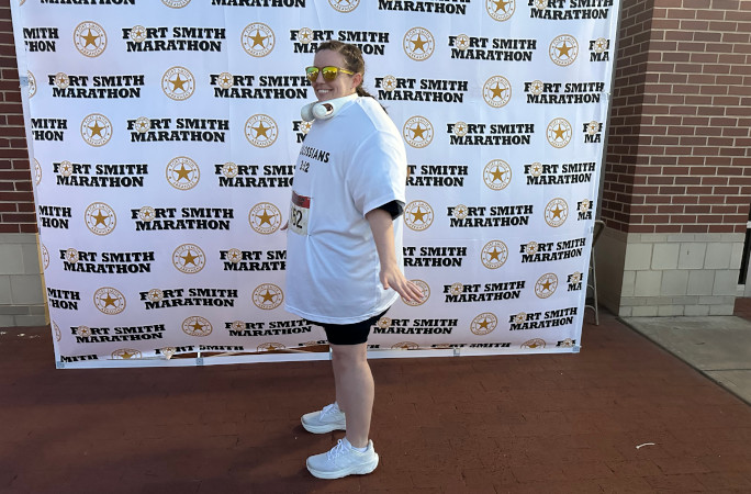 Meredith after the race posing with her shirts