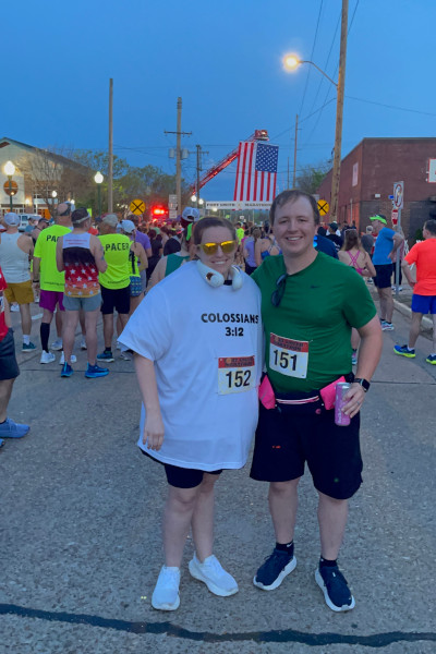Meredith and a man posing after the race