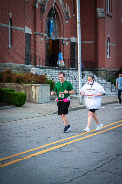 Meredith running with a man
