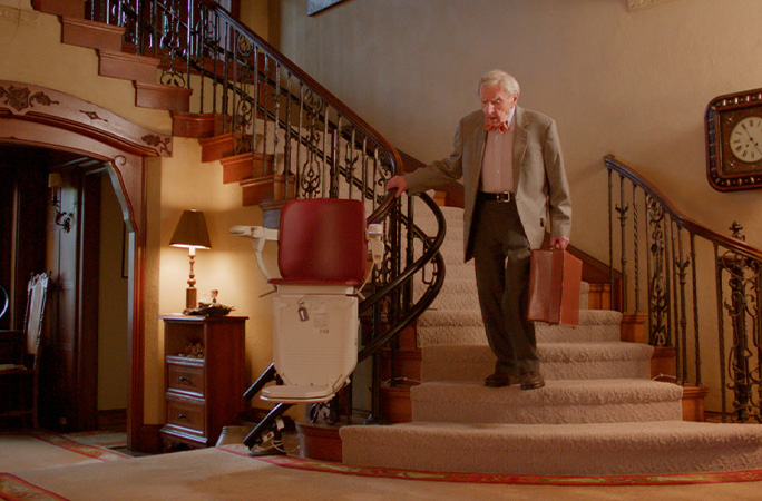 Dr Howard walking down some stairs