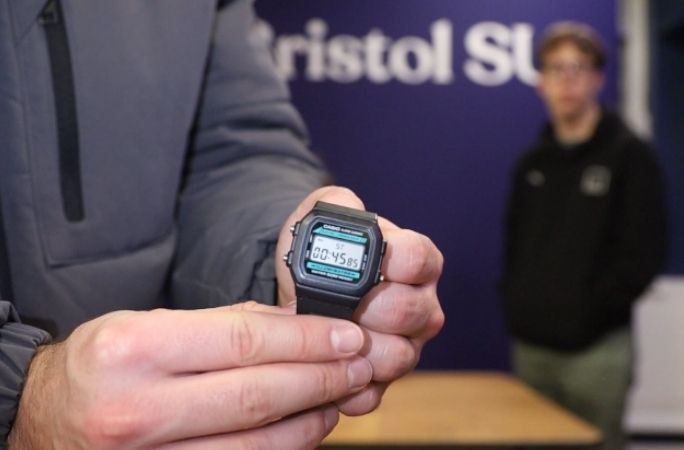  A hand holding a stopwatch