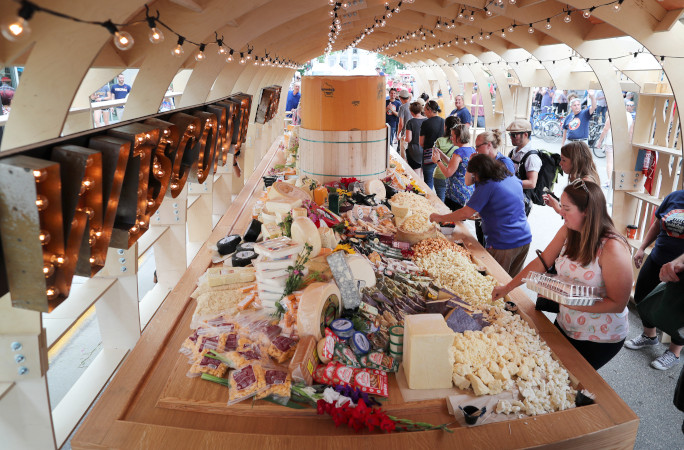 People eating the largest cheese platter