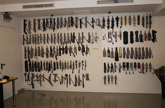 corkscrews hanging on a wall