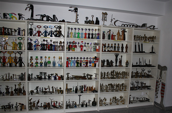 corkscrews hanging on a wall