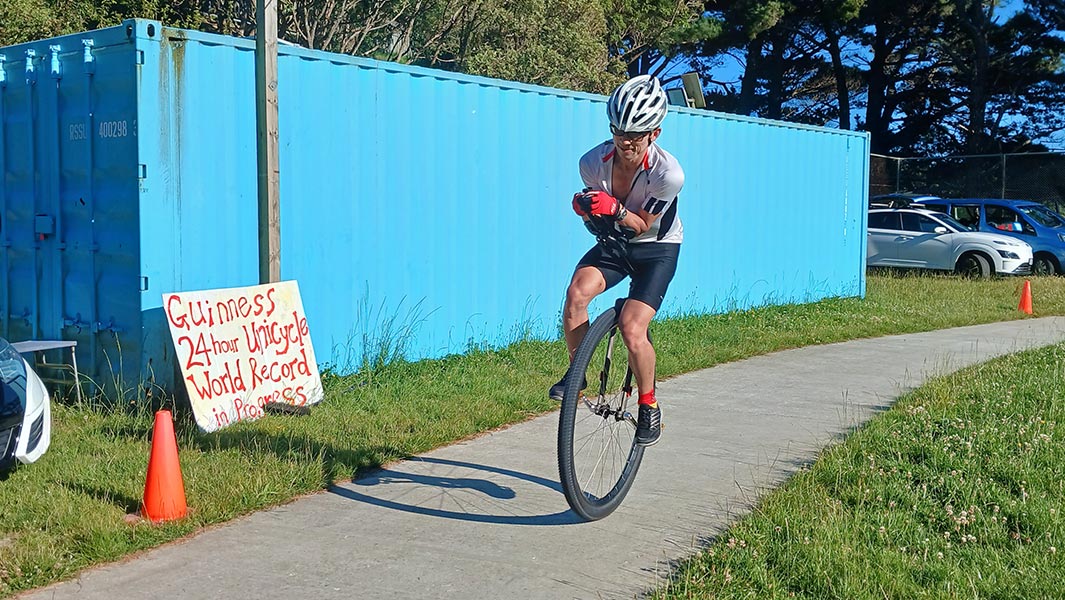 Two images of Ken Looi during his 24-hour unicyling record in 2025