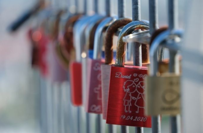 Love-locks chained to the railing