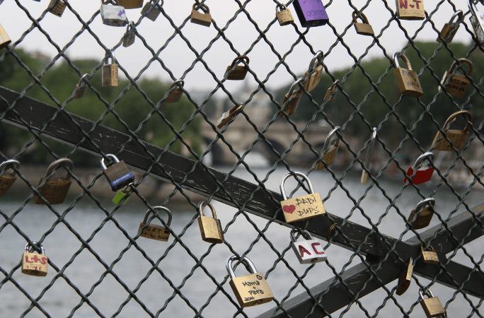 Multiple love-locks hanging on the bridge