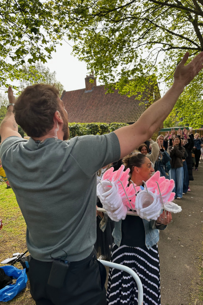 people gathered in a queue to get their bunny ears