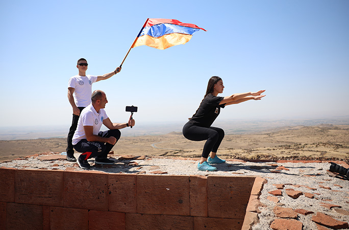 Mari doing squats on the castle