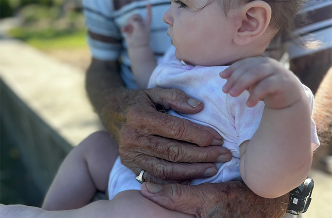 Isla sitting with Charles