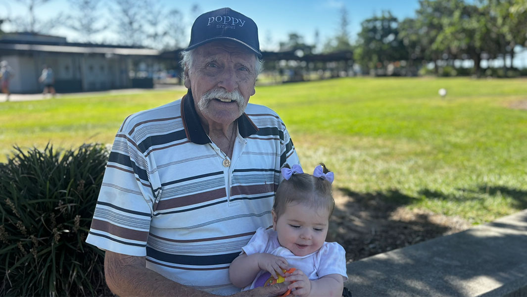 two images of Charles with his son and granddaughter