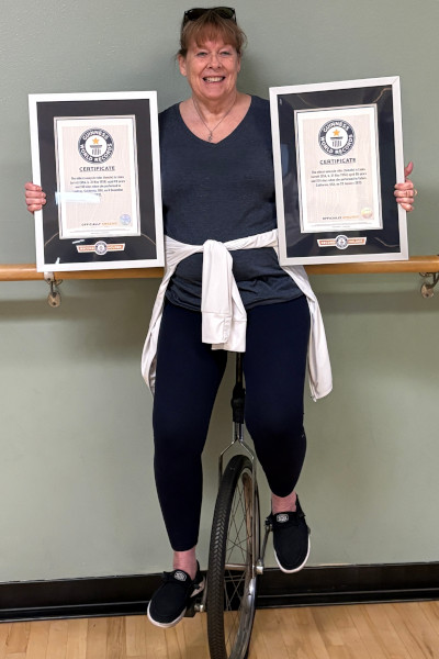 Linda holding her two GWR certificates