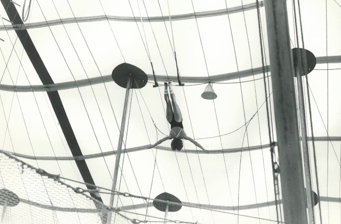 Linda hanging on the trapeze when she was younger