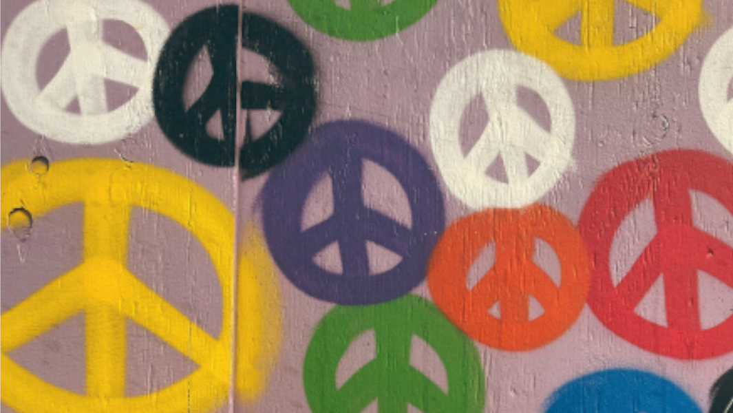 A group of colourful peace signs 
