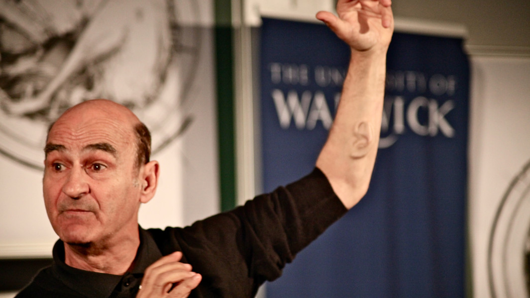 Stelarc showing off the ear on his arm
