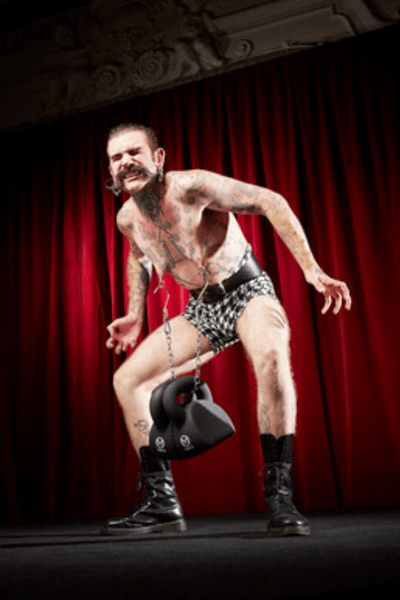 A man lifting weights with his nipples