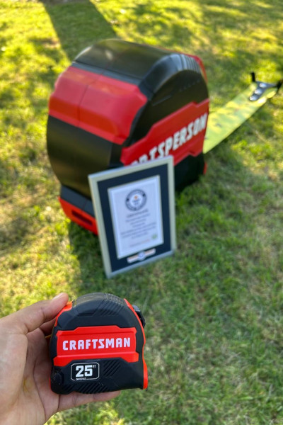 Big tape measure next to little tape measure