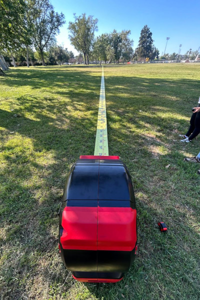 The tape measure extending across a park