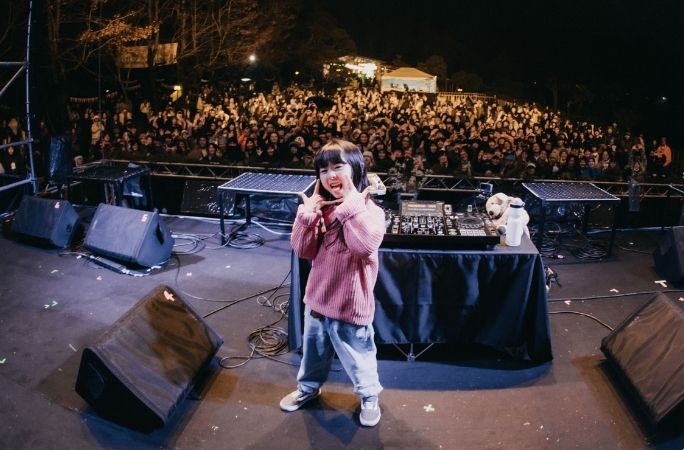 Youngest DJ standing at the stage
