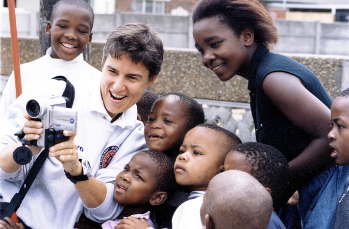 Ann showing videos to kids in Africa