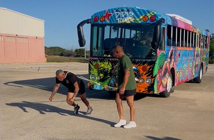 Egmond pulling a bus with his neck