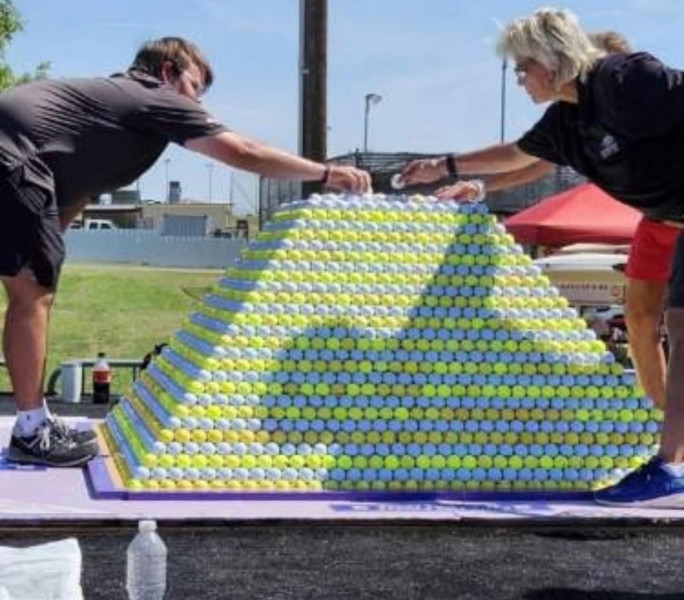 Placing balls at the top of the pyramid