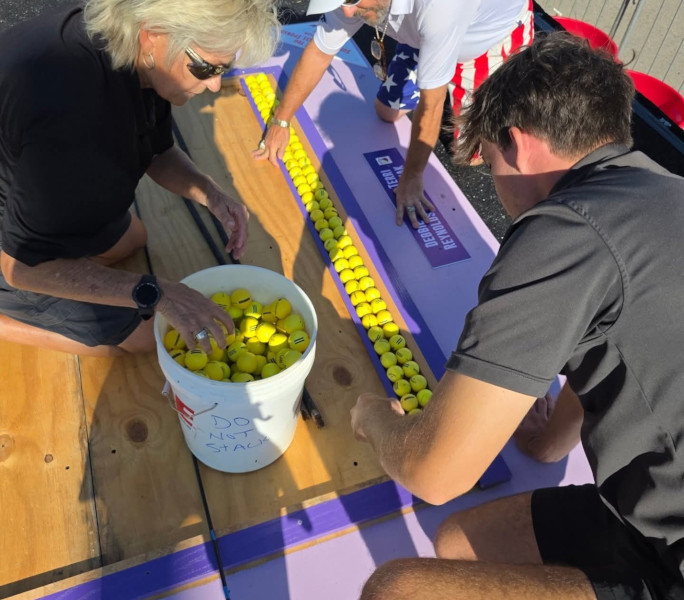 Closeup of the group placing the balls