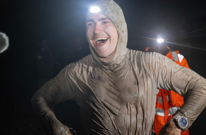 Antoine smiling while wearing a headlamp