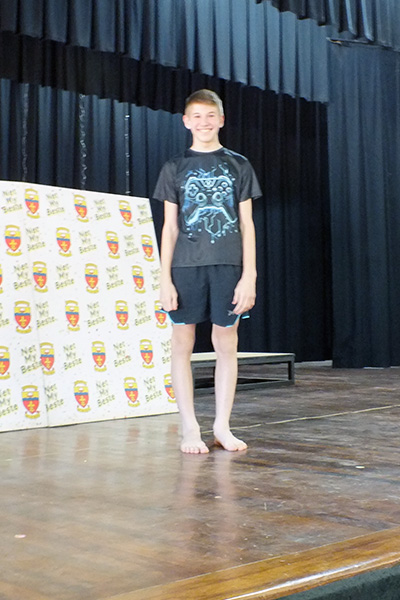 Chaz standing on stage