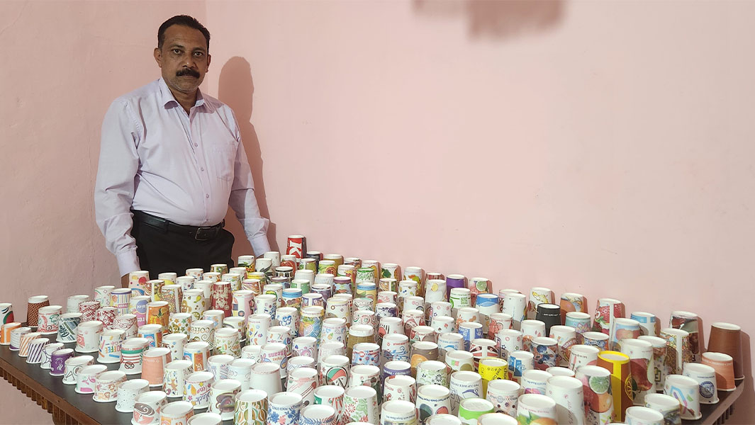 Sunil Joseph with his paper cup collection