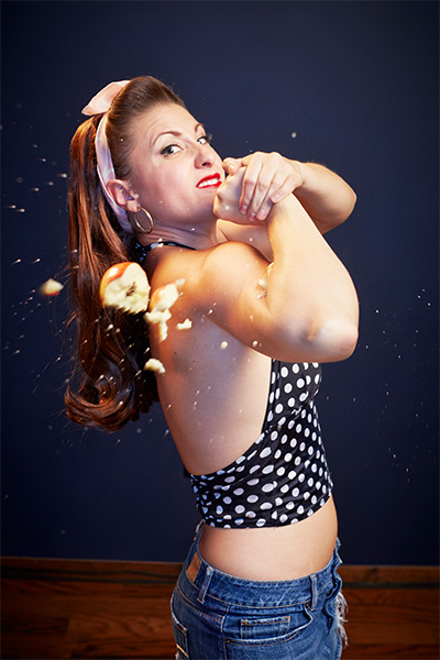 record holder crushing apples with her bicep
